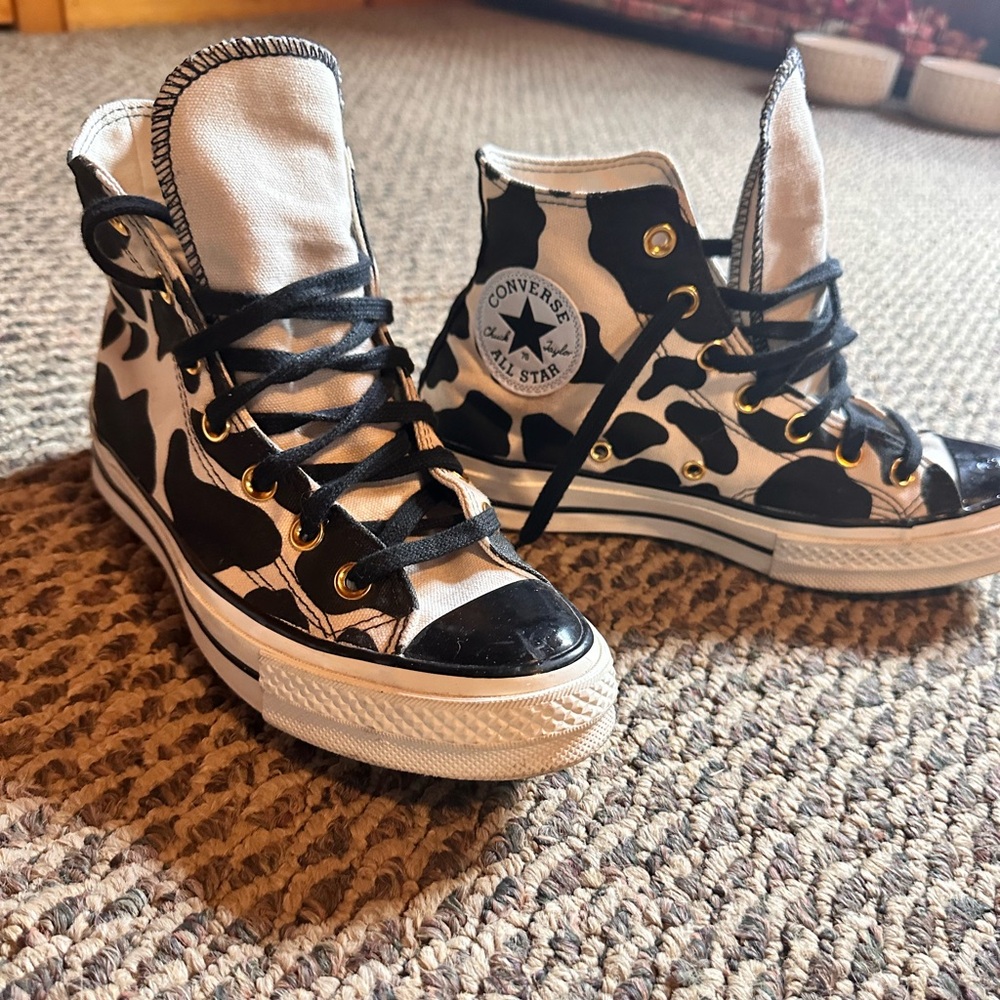 Custom black/white cow print chuck Taylors